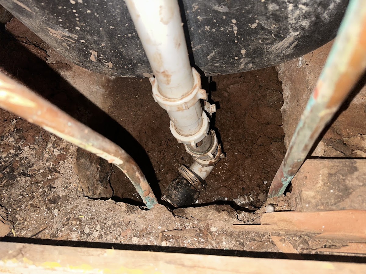 Monty's plumbing repair beneath a customer's home